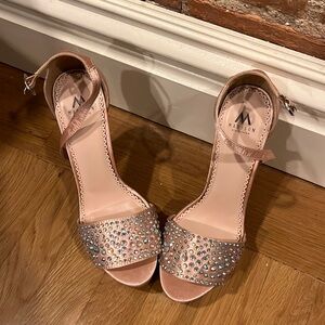 Never worn! Size 8 Pretty in Pink bedazzled heels!! There meant to be yours!